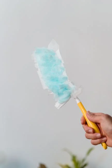 mobile-02 a-woman-is-cleaning-a-kitchen-sink-with-a-rag-sqomdoqb3ws